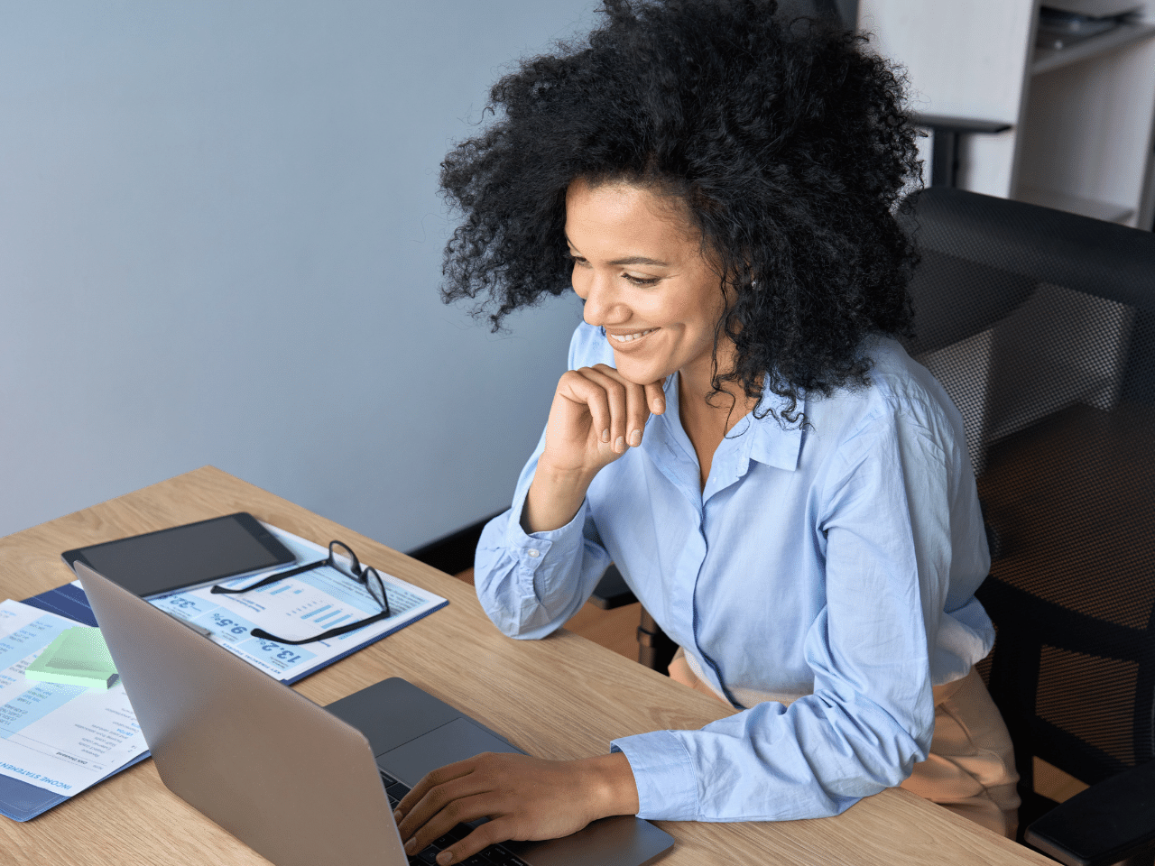 Smiling African American Businesswoman Working Typing Using Pc Laptop. Video Appointment Concept.