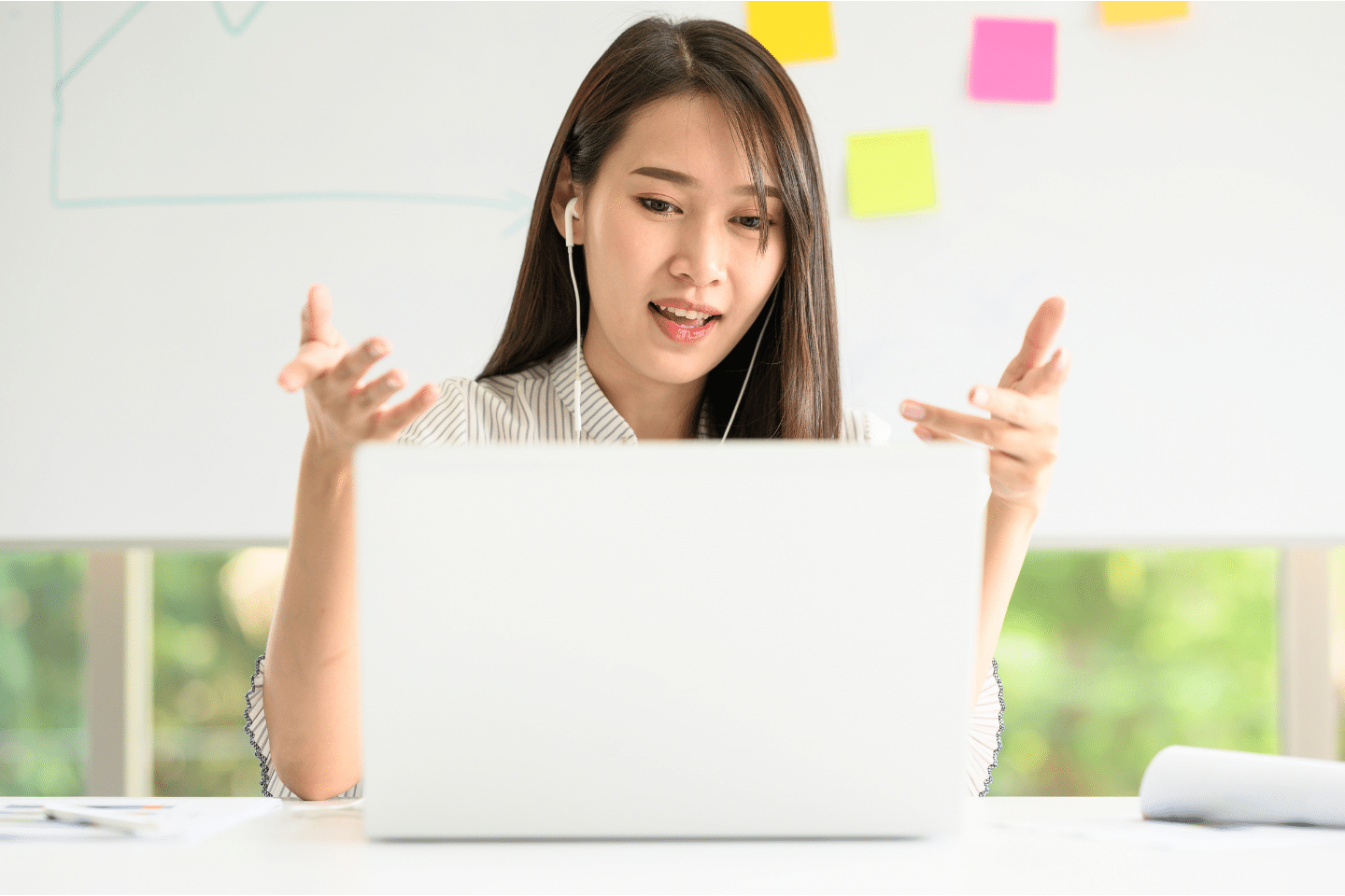 Asian woman having video meeting conference call via laptop. New normal working from home during coronavirus pandemic concept. Virtual Contact Concept.