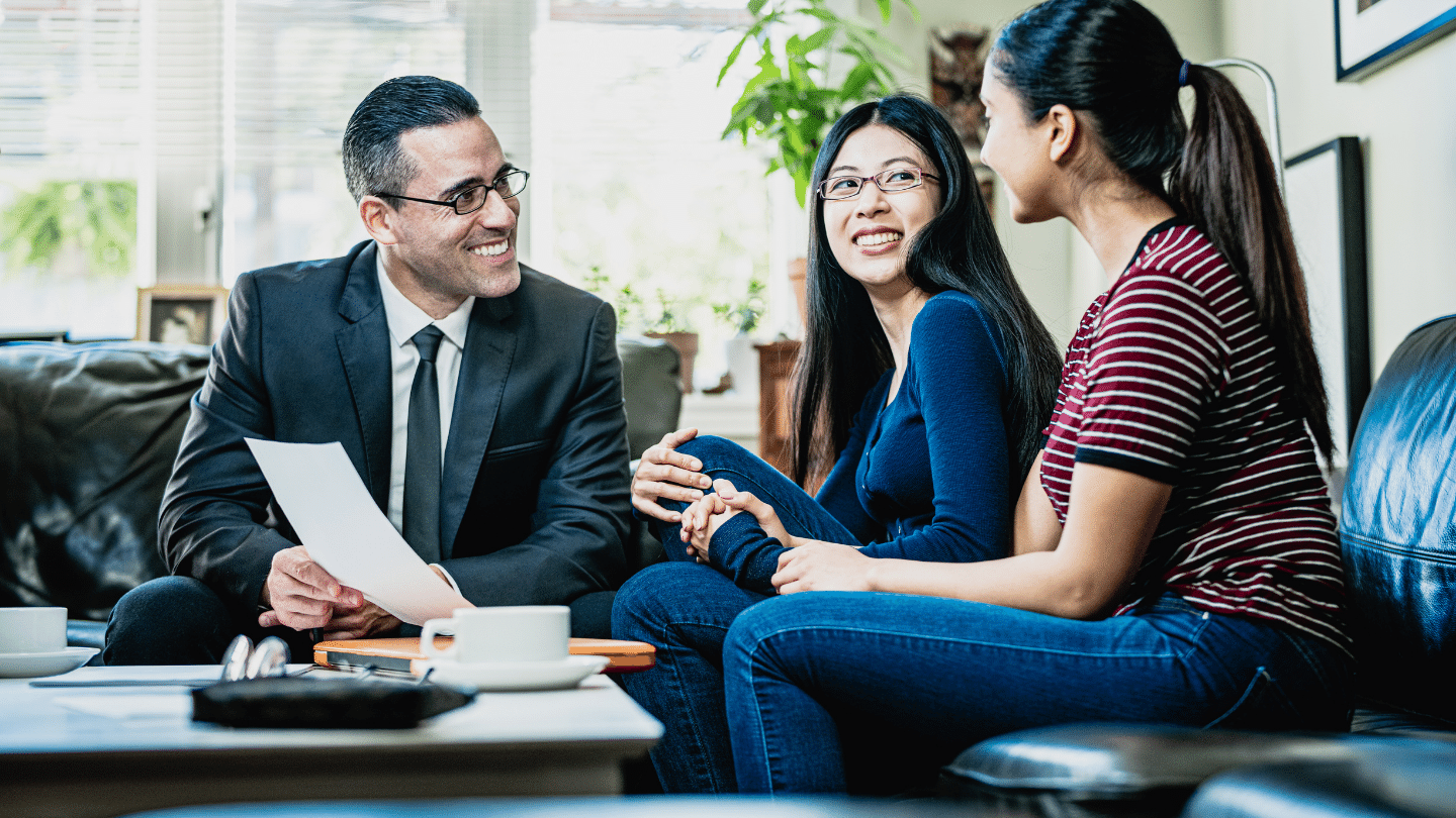 Financial advisor talking to a lesbian couple