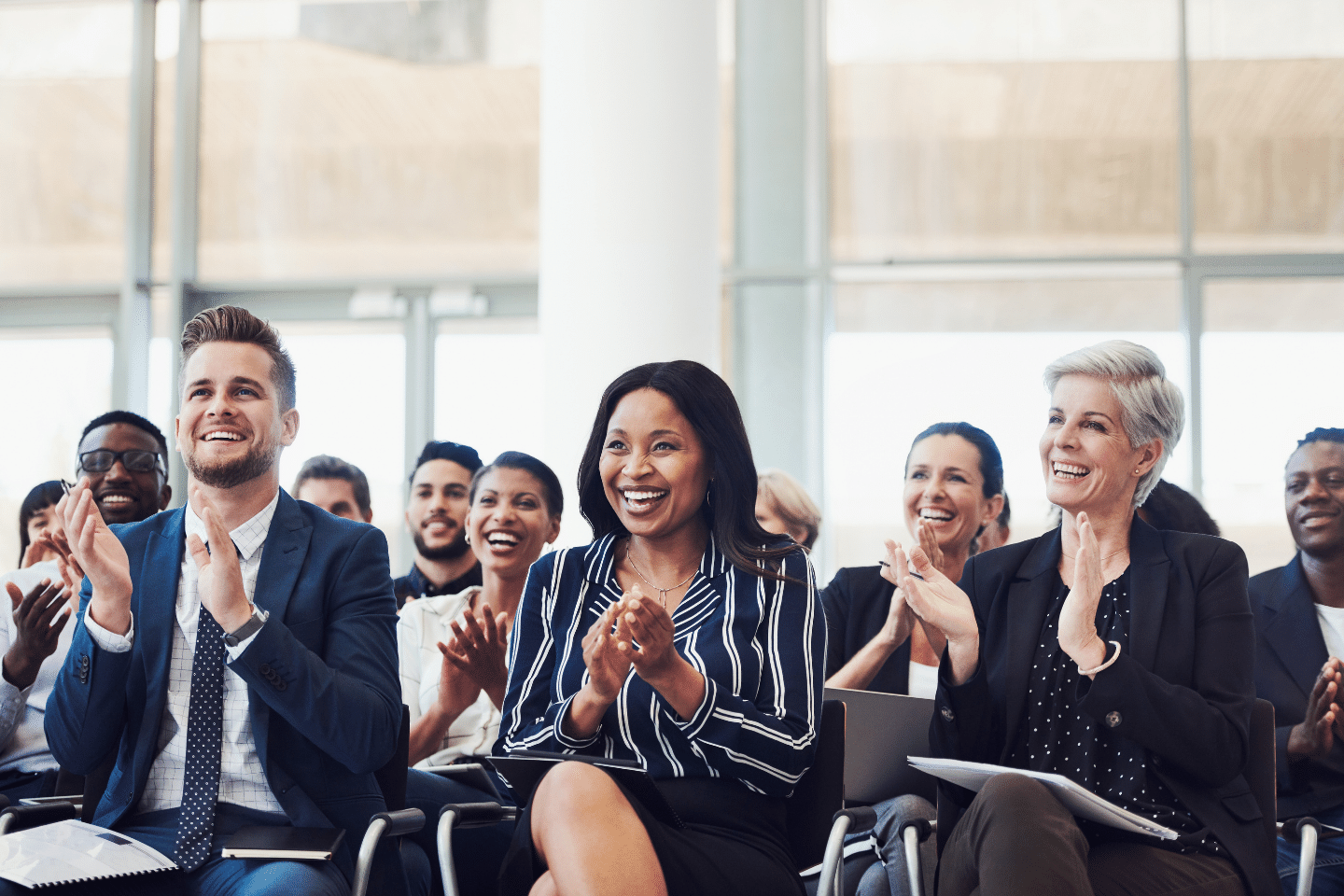 A happy, diverse audience. Speaking Engagement Concept.