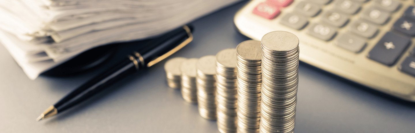 Financial Plan: Coins heap stair as growing graph symbol on finance working desk. Financial Planning Concept