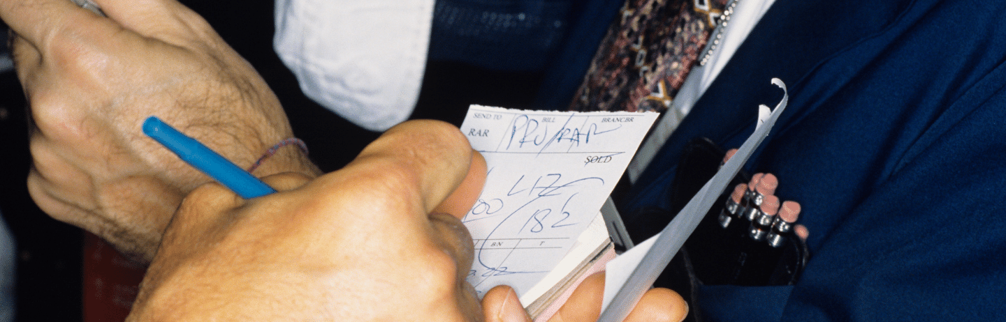 New York Stock Exchange transactions, close-up of traders hands. Market Concept.