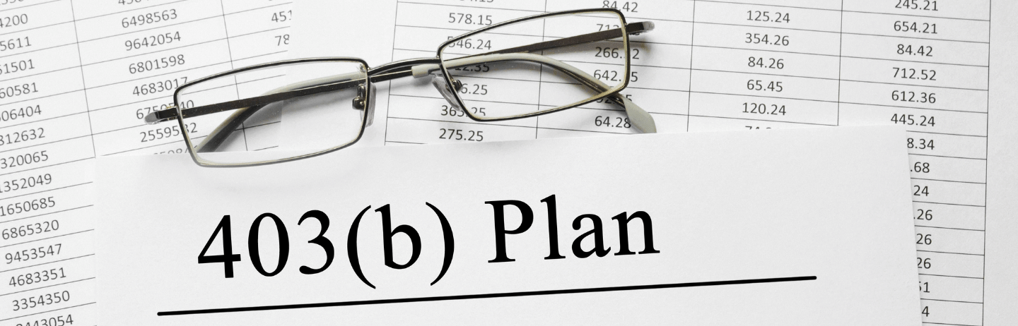 Paper with 403 b plan on a table