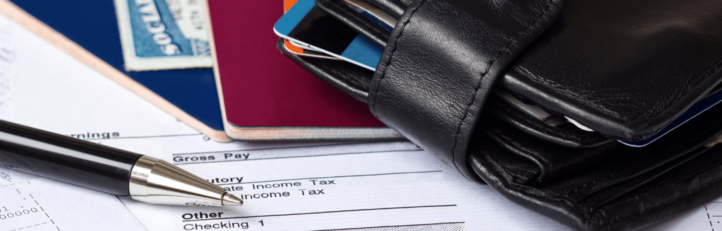 Personal Finances: Photograph of paycheck, passports, credit/debt cards, and Social Security card.