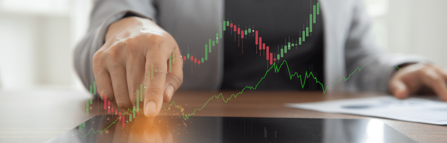 Person using digital tablet with up trend line graph stock market and bar chart volume trading with index forex: Investment Portfolio Rebalancing Concept