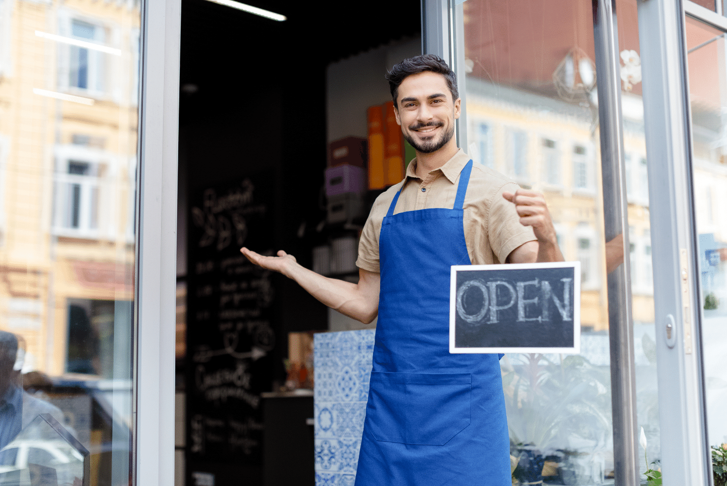 Small business owner with open sign. Ownership Concept