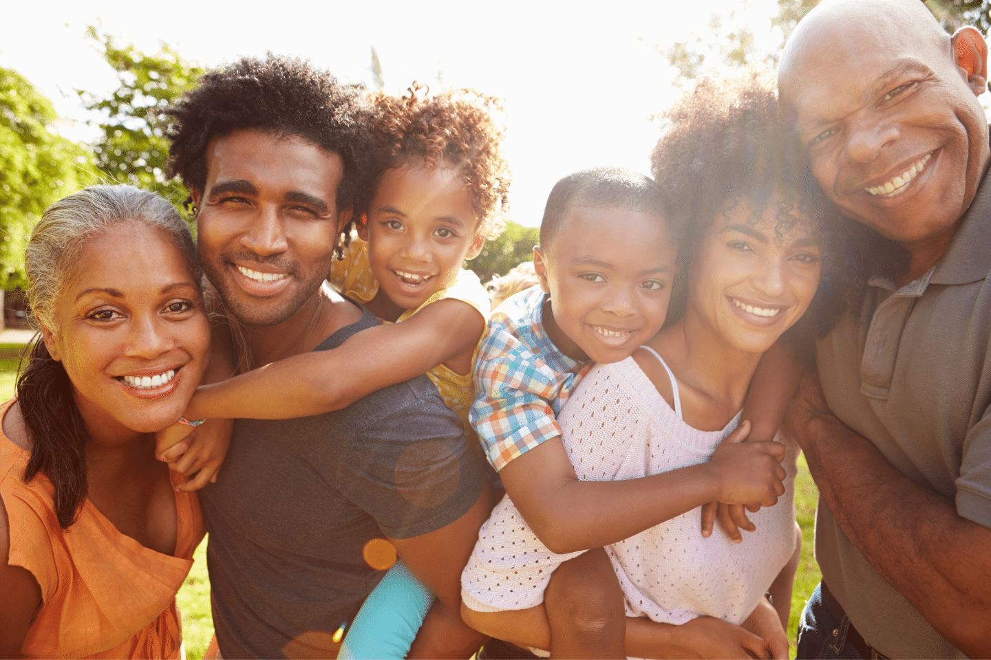 Multi generation family in the park together. Transferring/Estate Planning Concept.