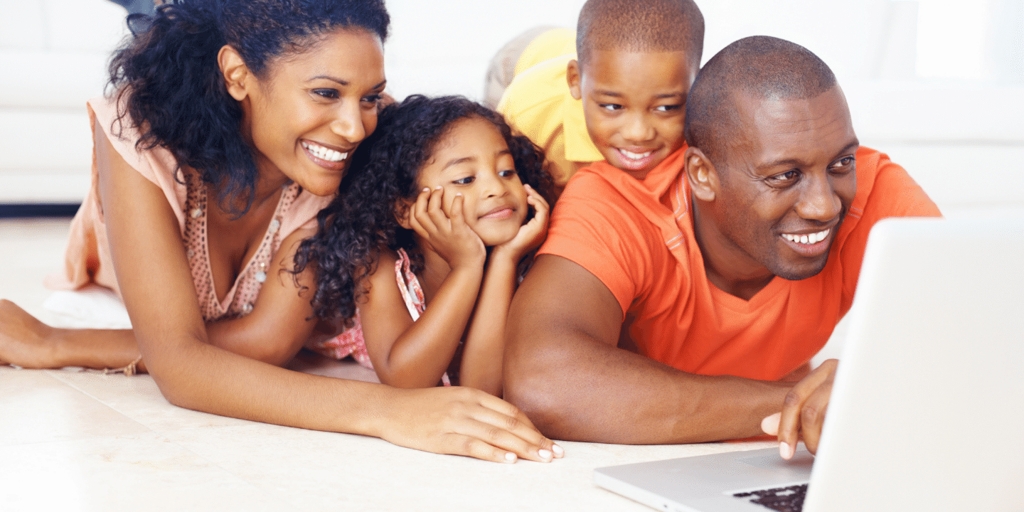 African American family using laptop. Insurance Planning Concept.