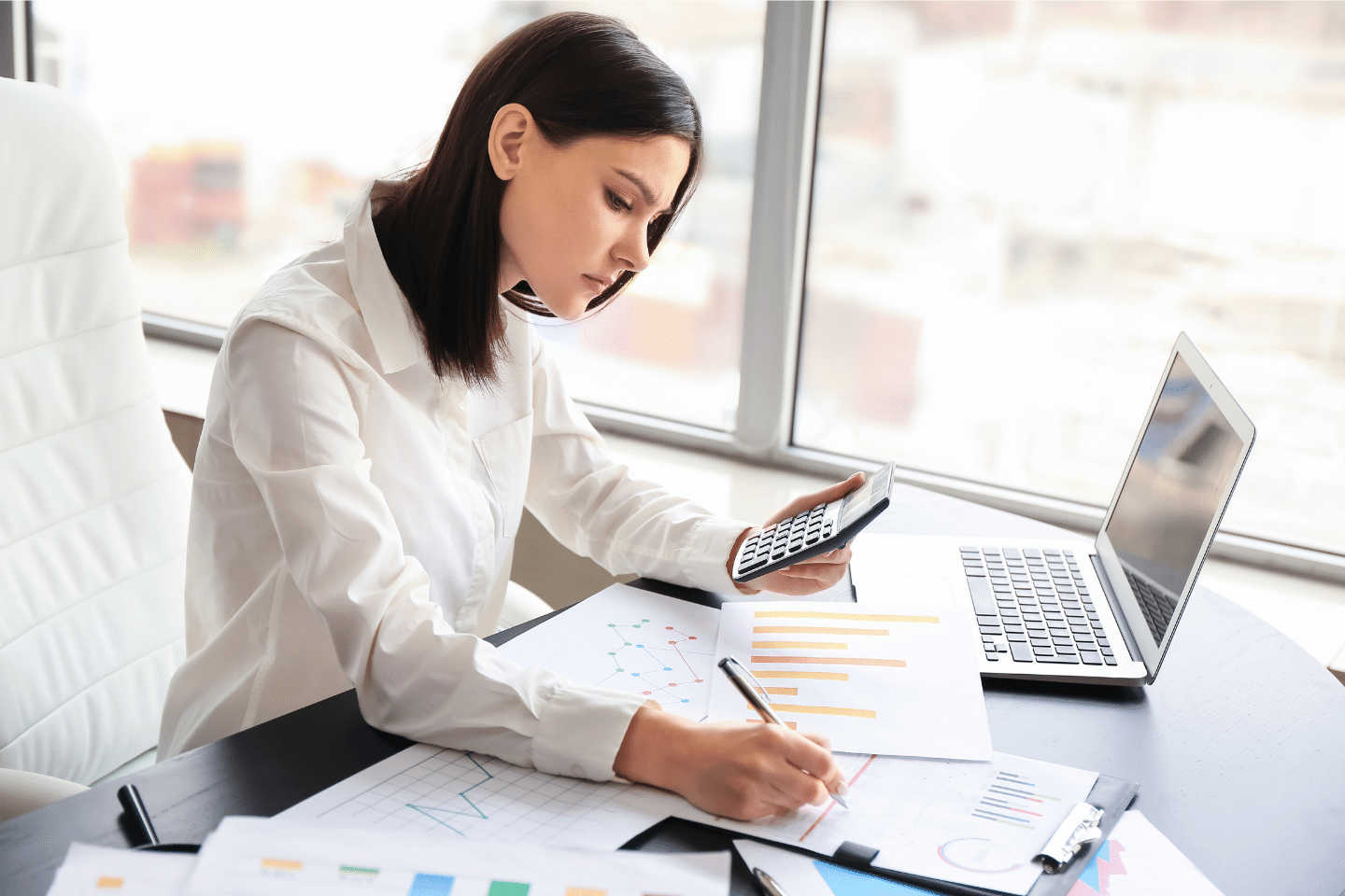 Young female working on portfolio in office