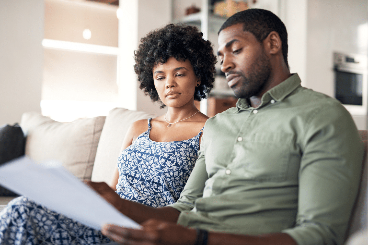 Secure marriage, secure future: Shot of young couple going over paperwork at home. Ensuring basic necessities.