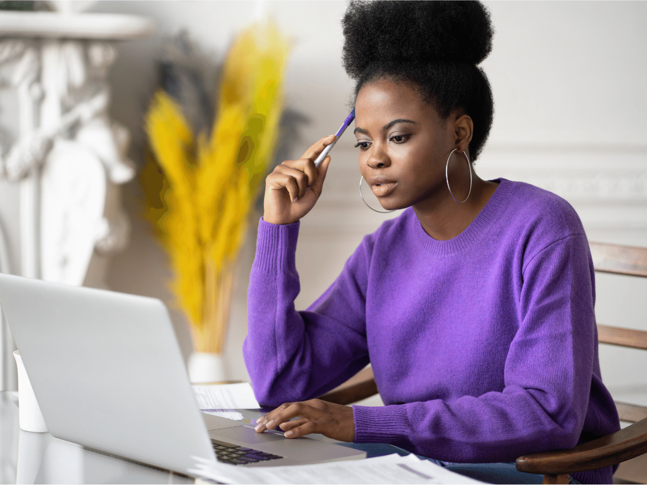 Diverse Female Student Studying with a Laptop on the Table